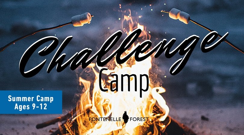 A picture of a campfire with the text overlay "challenge camp"