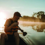 Image of a man canoeing in a river