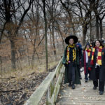 Group of friends dressed as Harry Potter characters walking the trail