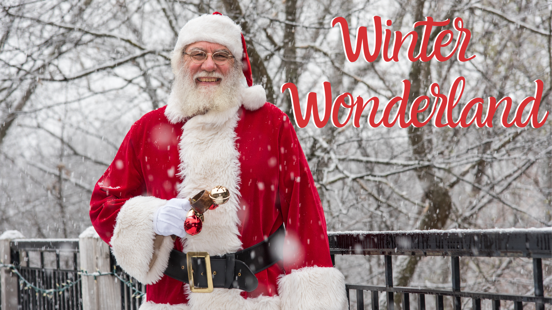 Santa Claus next to a railing in the winter time with snow. It has the text in red, "Winter Wonderland"