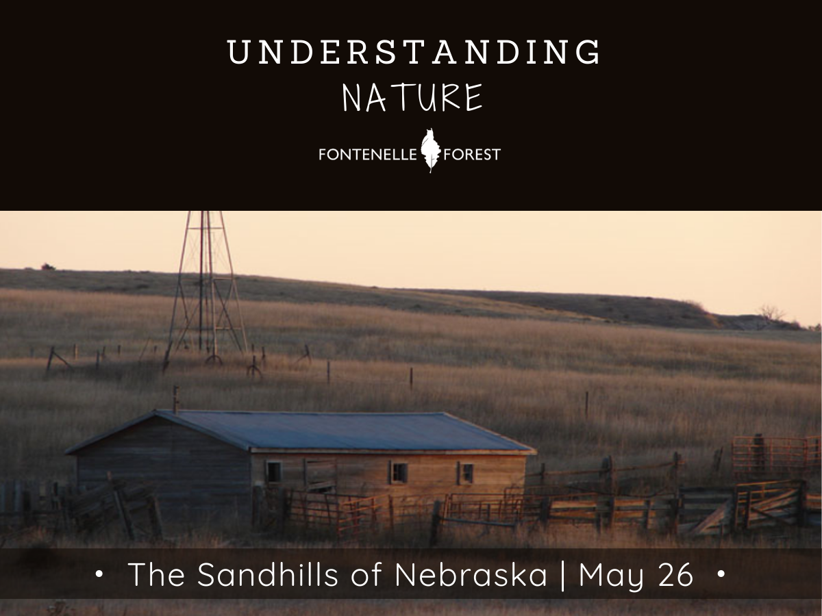 A picture of a building surrounded by a fense in rural Nebraska.  It has a black heading with white text that says, "UNDERSTANDING NATURE" and the Fontenelle Forest logo. It has a black banner near the bottom of the picture. It has the white text, "The Sandhills of Nebraska I May 26"