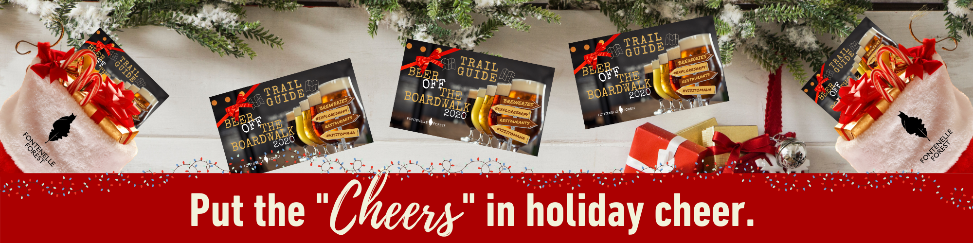 a picture of several gift cards on a white tree skirt. It has a red banner with the white text, "Put the "Cheers" in holiday cheer."