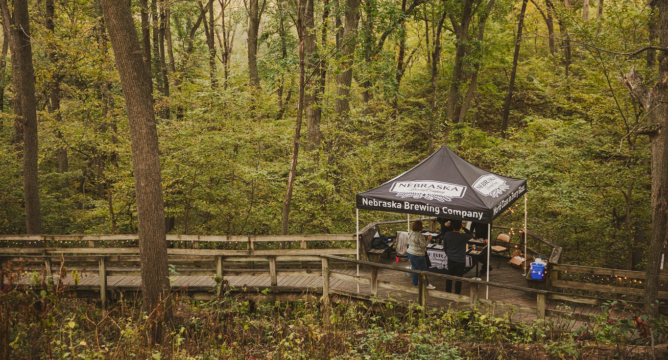 An image of a beer on the boardwalk canopy set up on the Fontenelle Forest boardwalk.