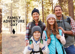 An image of a smiling family in hiking gear standing in the woods overlayed by the words "Family Adventure Day" and the Fontenelle Forest logo.