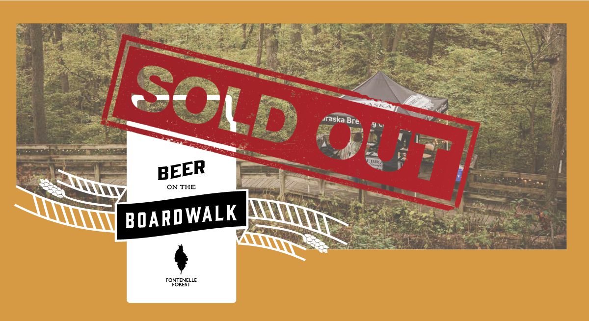 An orange graphic displaying a picture of the Fontenelle Forest boardwalk with a canopy overlayed by a beer can icon with the words "Beer on the Boardwalk" and the Fontenelle Forest logo. The words "Sold Out" are stamped over the image in red ink.